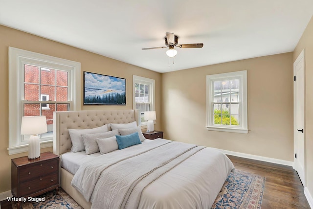 1191 Wilson Rd, Bellevue, KY 41073 - bedroom featuring baseboards, multiple windows, and wood finished floors