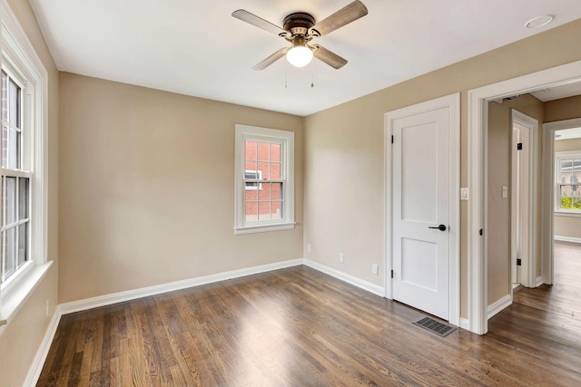 1191 Wilson Rd, Bellevue, KY 41073 - spare room featuring a ceiling fan, dark wood-type flooring, and baseboards
