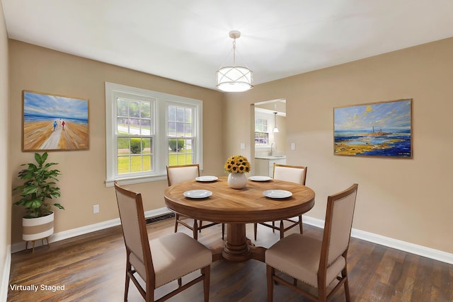 1191 Wilson Rd, Bellevue, KY 41073 - dining space featuring dark wood-type flooring and baseboards