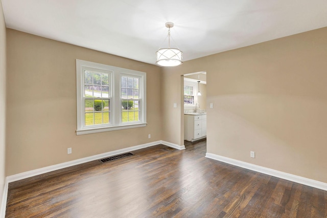 1191 Wilson Rd, Bellevue, KY 41073 - unfurnished room featuring baseboards and dark wood finished floors