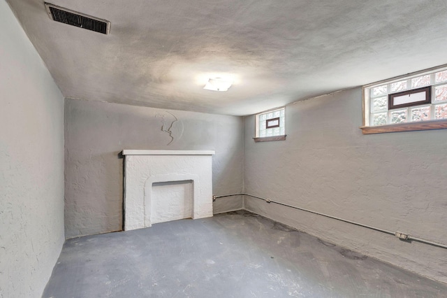 1191 Wilson Rd, Bellevue, KY 41073 - basement featuring a textured wall and a fireplace
