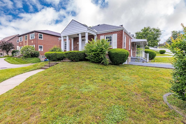 1191 Wilson Rd, Bellevue, KY 41073 - view of front facade with brick siding and a front yard