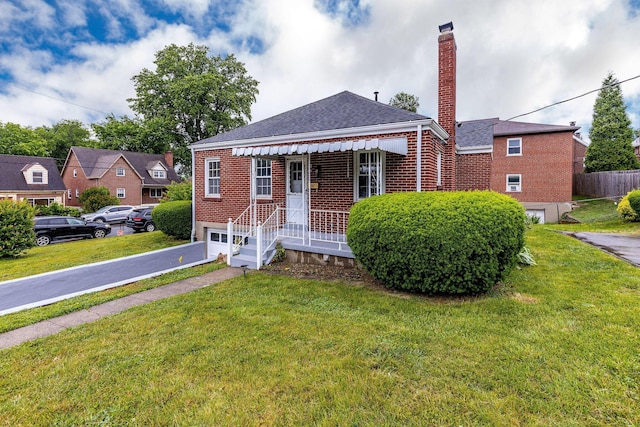 1191 Wilson Rd, Bellevue, KY 41073 - bungalow-style home with brick siding, driveway, a chimney, a shingled roof, and an attached garage