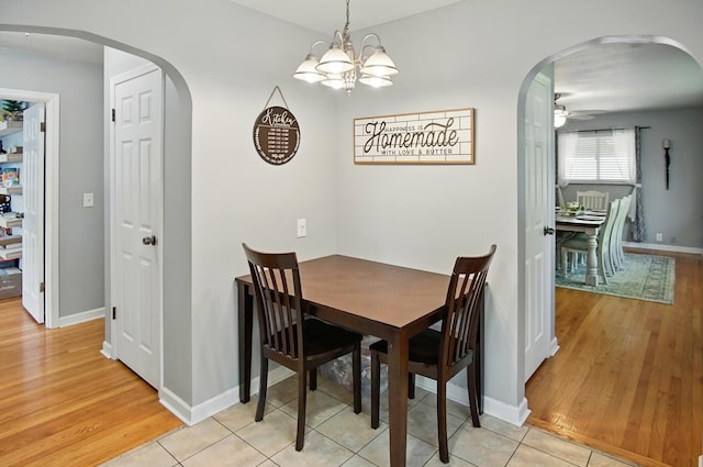 8347 Riley Rd, Alexandria, KY 41001 - dining room featuring arched walkways, a ceiling fan, and light wood-style floors