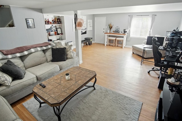 8347 Riley Rd, Alexandria, KY 41001 - living area featuring a dry bar, light wood finished floors, and wooden walls