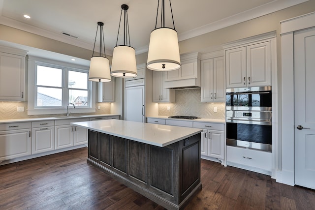 1 Highland Ave Unit 208, Fort Thomas, KY 41075 - kitchen with a sink, light countertops, stainless steel double oven, a center island, and ornamental molding