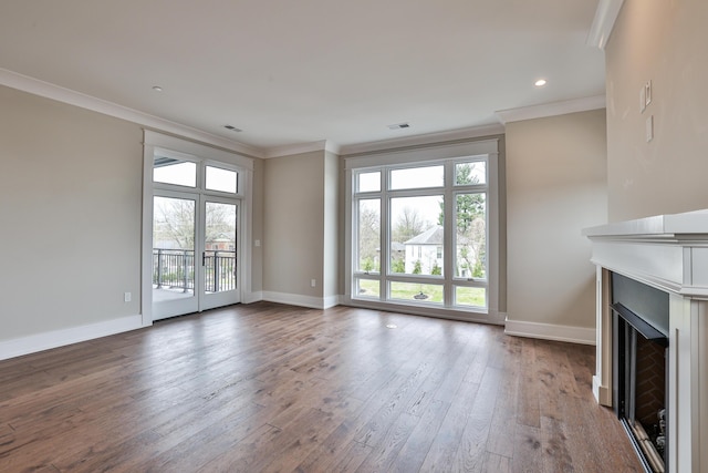 1 Highland Ave Unit 208, Fort Thomas, KY 41075 - unfurnished living room featuring crown molding, baseboards, hardwood / wood-style flooring, a fireplace, and recessed lighting
