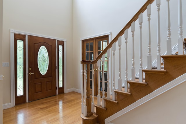 405 Alexander Rd, Crittenden, KY 41030 - foyer entrance with stairway, wood finished floors, a high ceiling, baseboards, and healthy amount of natural light