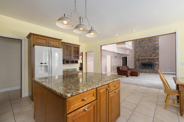 405 Alexander Rd, Crittenden, KY 41030 - kitchen with white fridge with ice dispenser, light tile patterned flooring, light colored carpet, stone countertops, and glass insert cabinets