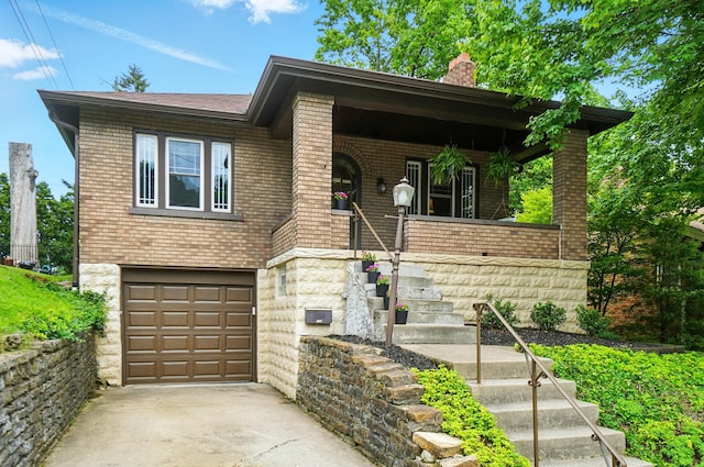 134 Strathmore Ave, Fort Thomas, KY 41075 - view of front of house featuring a chimney, concrete driveway, a porch, an attached garage, and brick siding