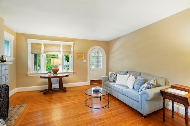 134 Strathmore Ave, Fort Thomas, KY 41075 - living room with baseboards, light wood-style floors, and a tile fireplace