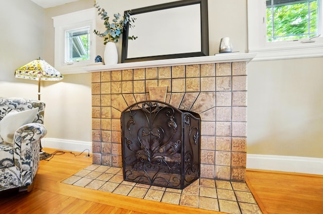 134 Strathmore Ave, Fort Thomas, KY 41075 - detailed view of baseboards, wood finished floors, and a fireplace