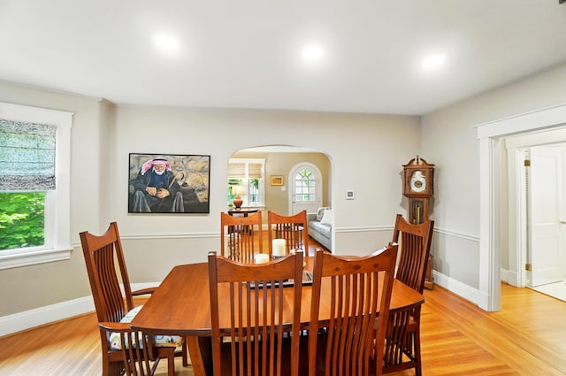 134 Strathmore Ave, Fort Thomas, KY 41075 - dining area featuring arched walkways, light wood finished floors, recessed lighting, and baseboards