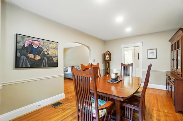 134 Strathmore Ave, Fort Thomas, KY 41075 - dining space with light wood finished floors, baseboards, recessed lighting, and arched walkways