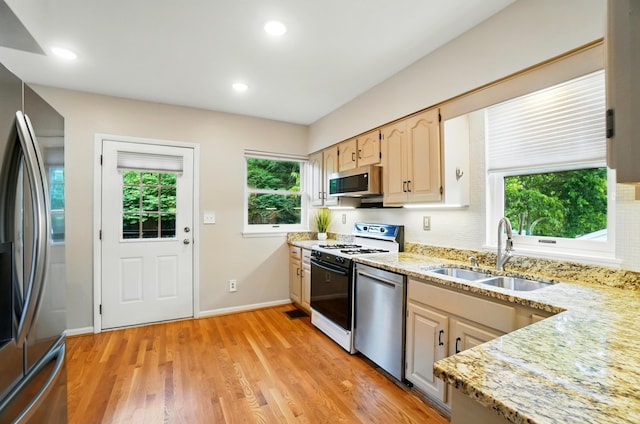 134 Strathmore Ave, Fort Thomas, KY 41075 - kitchen featuring a sink, stainless steel appliances, healthy amount of natural light, light stone countertops, and recessed lighting