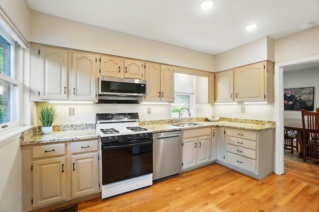 134 Strathmore Ave, Fort Thomas, KY 41075 - kitchen with stainless steel appliances, a sink, light stone countertops, light wood-style flooring, and recessed lighting