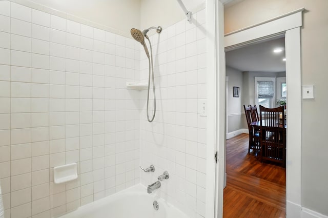 134 Strathmore Ave, Fort Thomas, KY 41075 - bathroom with shower / tub combination, wood finished floors, and baseboards