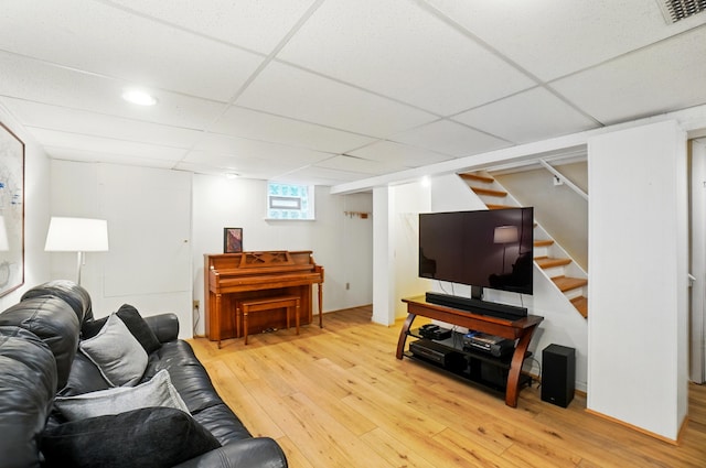 134 Strathmore Ave, Fort Thomas, KY 41075 - living area featuring light wood-type flooring, stairway, and a drop ceiling