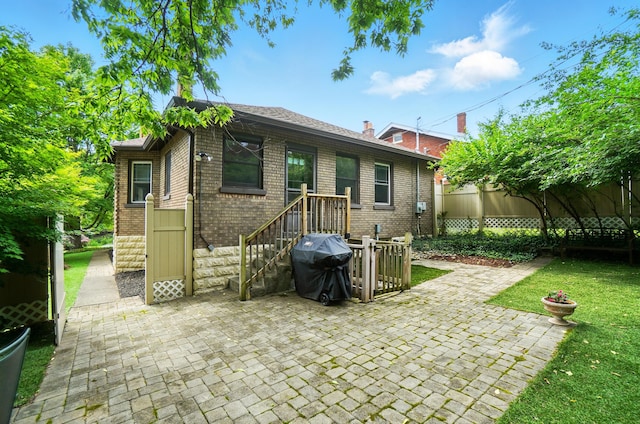 134 Strathmore Ave, Fort Thomas, KY 41075 - rear view of house with brick siding and a patio area