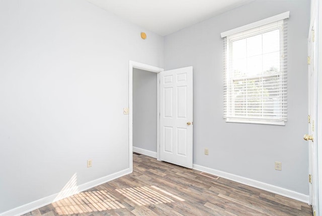 718 Central Ave, Newport, KY 41071 - spare room featuring wood finished floors and baseboards