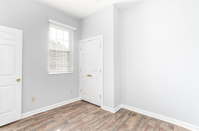 718 Central Ave, Newport, KY 41071 - spare room with wood finished floors and baseboards