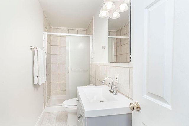 718 Central Ave, Newport, KY 41071 - full bath with vanity, toilet, a stall shower, and tile walls