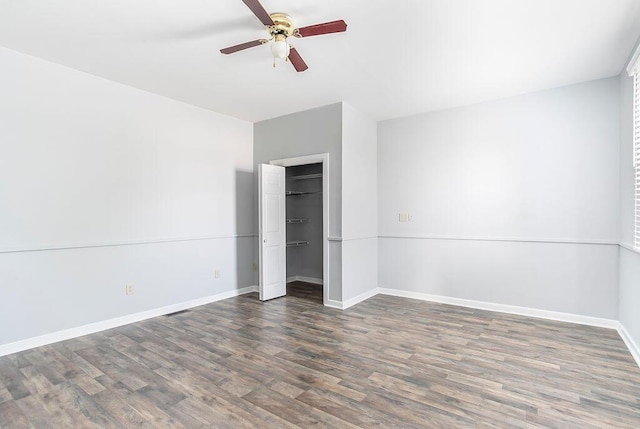 718 Central Ave, Newport, KY 41071 - unfurnished bedroom featuring wood finished floors, baseboards, ceiling fan, and a closet