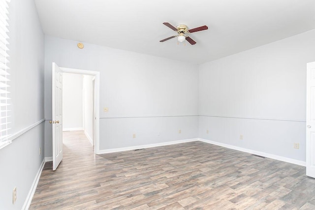 718 Central Ave, Newport, KY 41071 - unfurnished room with ceiling fan, wood finished floors, baseboards, and a smoke detector