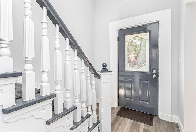 718 Central Ave, Newport, KY 41071 - entrance foyer featuring wood finished floors, baseboards, and stairs