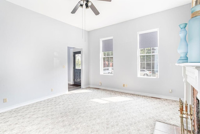 718 Central Ave, Newport, KY 41071 - unfurnished living room featuring plenty of natural light, ceiling fan, carpet flooring, and a fireplace with flush hearth
