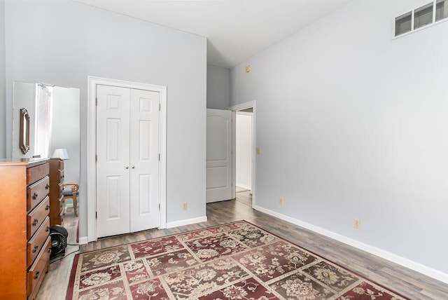 718 Central Ave, Newport, KY 41071 - bedroom with wood finished floors, a closet, and baseboards