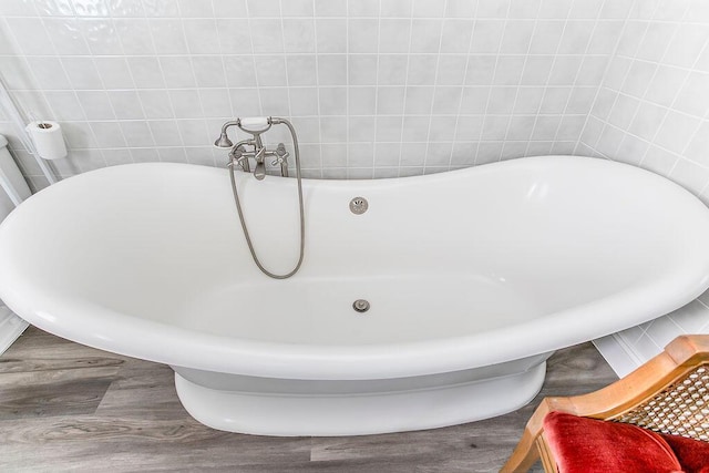 718 Central Ave, Newport, KY 41071 - full bath featuring a soaking tub and wood finished floors