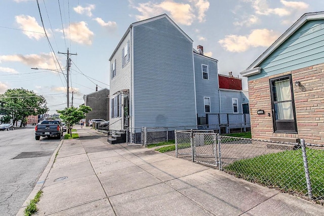 718 Central Ave, Newport, KY 41071 - view of property exterior with a gate, entry steps, and stone siding