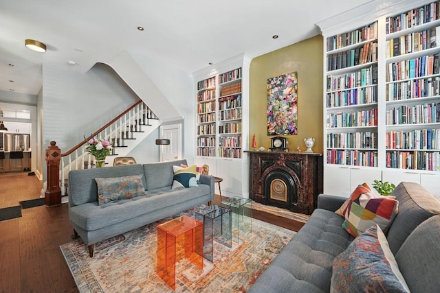 842 Monroe St, Newport, KY 41071 - living area with built in shelves, stairs, hardwood / wood-style floors, a fireplace, and recessed lighting