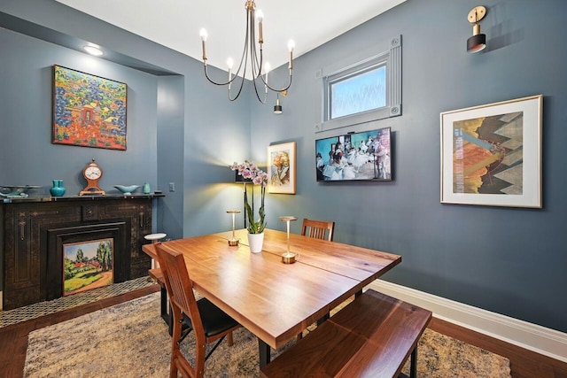 842 Monroe St, Newport, KY 41071 - dining room featuring a chandelier, a fireplace with flush hearth, wood finished floors, and recessed lighting