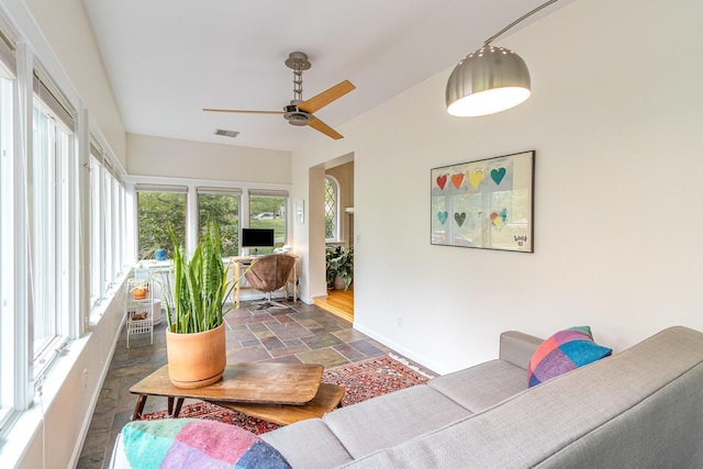 1058 Emerson Rd, Park Hills, KY 41011 - sunroom with stone tile floors, plenty of natural light, and baseboards