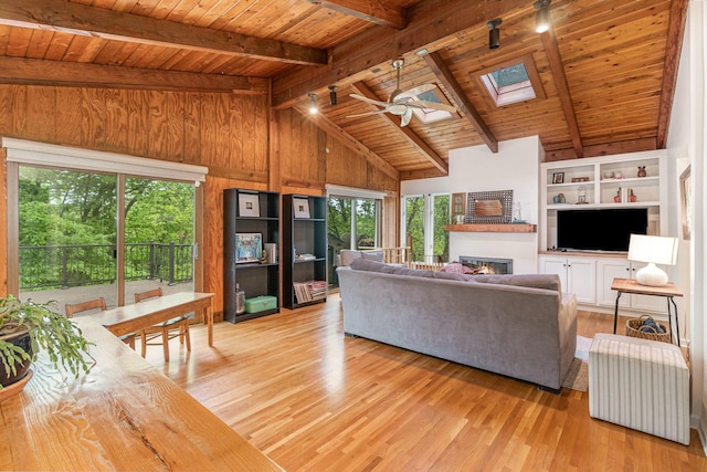 1058 Emerson Rd, Park Hills, KY 41011 - living room featuring a ceiling fan, healthy amount of natural light, light wood-style floors, wooden ceiling, and wooden walls