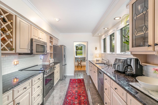 1058 Emerson Rd, Park Hills, KY 41011 - kitchen featuring stainless steel appliances, a sink, decorative backsplash, ornamental molding, and glass insert cabinets