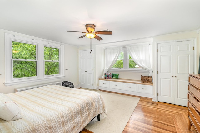 1058 Emerson Rd, Park Hills, KY 41011 - bedroom with radiator heating unit, a ceiling fan, and light wood-style flooring