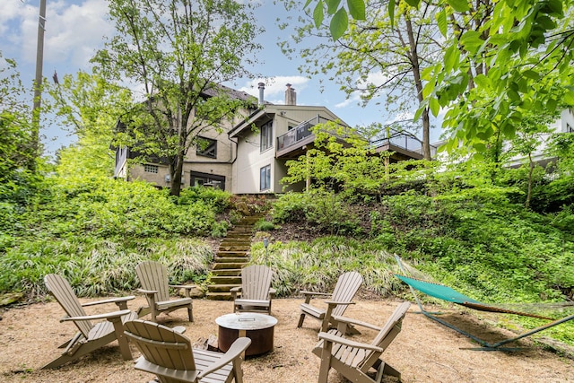 1058 Emerson Rd, Park Hills, KY 41011 - view of yard with stairs, a fire pit, and a balcony