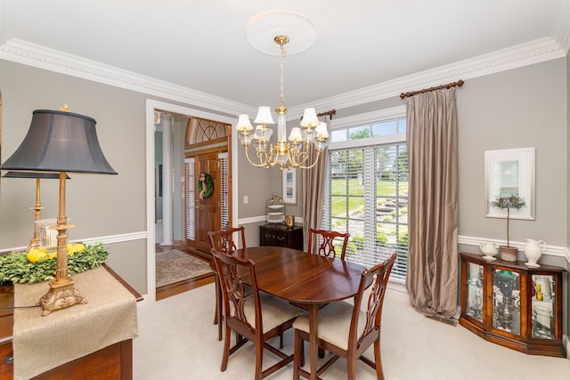 2090 Edenderry Dr, Fort Mitchell, KY 41017 - dining room featuring ornamental molding, light carpet, and a chandelier