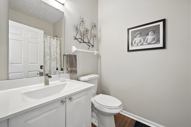 9072 Timberbrook Ln Unit B, Florence, KY 41042 - bathroom with wood finished floors, vanity, toilet, baseboards, and curtained shower