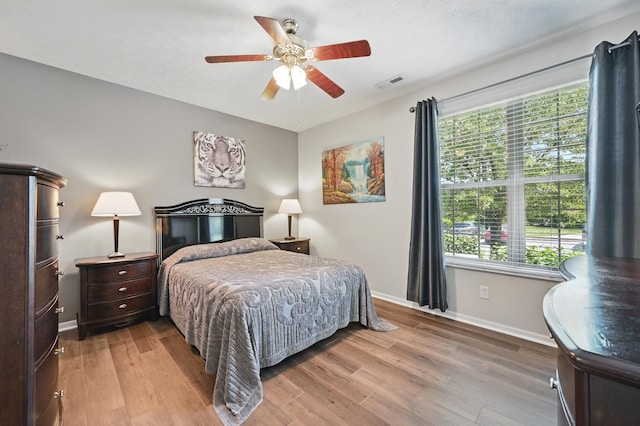 9072 Timberbrook Ln Unit B, Florence, KY 41042 - bedroom with baseboards, wood finished floors, and multiple windows