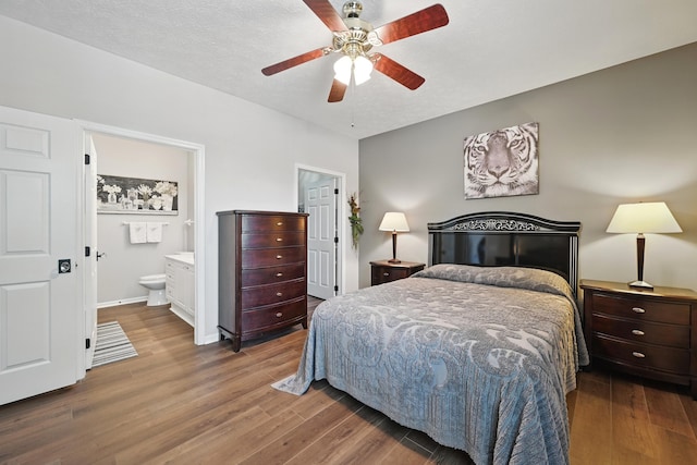 9072 Timberbrook Ln Unit B, Florence, KY 41042 - bedroom featuring wood finished floors, connected bathroom, a ceiling fan, and baseboards