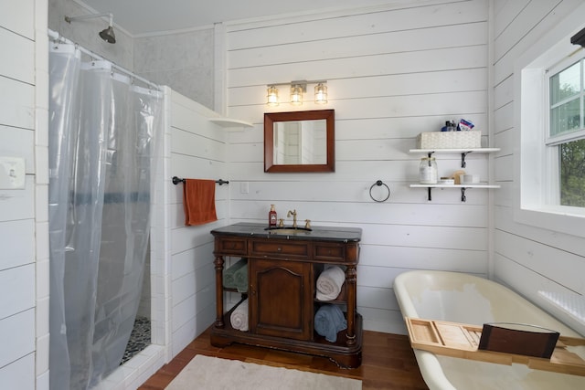 1120 Keefer Rd, Corinth, KY 41010 - bathroom featuring wood finished floors, a shower stall, vanity, a freestanding tub, and wood walls