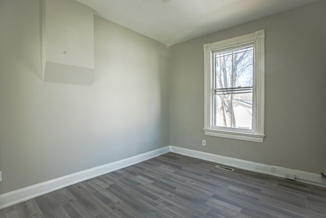 1707 Eastern Ave Unit 1709, Covington, KY 41014 - unfurnished room featuring healthy amount of natural light, dark wood-style floors, and baseboards