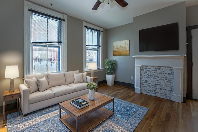 1707 Eastern Ave Unit 1709, Covington, KY 41014 - living area featuring a ceiling fan, wood finished floors, a glass covered fireplace, and baseboards
