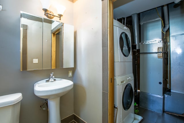 1707 Eastern Ave Unit 1709, Covington, KY 41014 - bathroom with stacked washer / drying machine and toilet