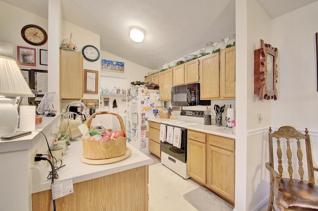 2239 Teal Briar Ln Unit 206, Burlington, KY 41005 - kitchen with black microwave, range with electric cooktop, light brown cabinetry, freestanding refrigerator, and lofted ceiling