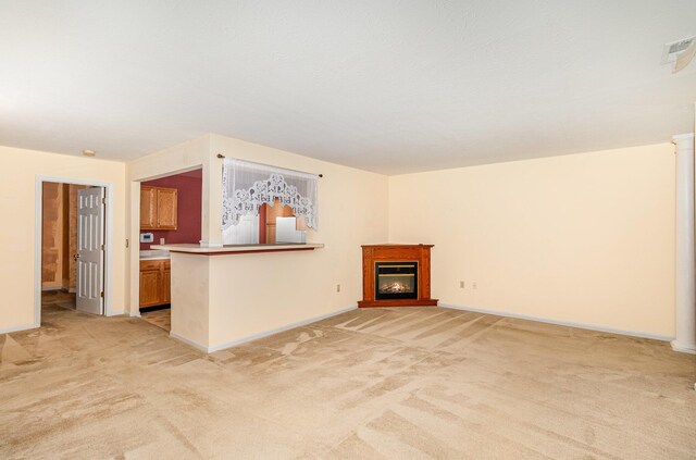202 Langshire Ct, Florence, KY 41042 - unfurnished living room featuring light colored carpet, a glass covered fireplace, and baseboards
